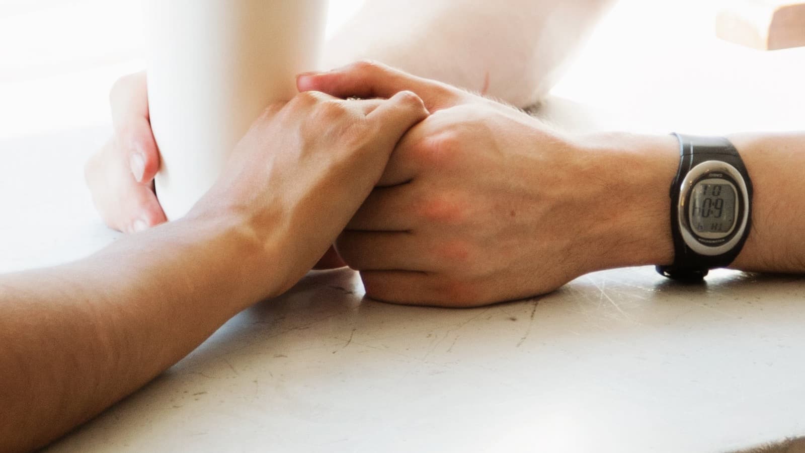 A heart, an open hand, and a lock icon representing care versus control
